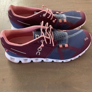 On Running On cloud shows maroon blue and pink size 8.5 worn once